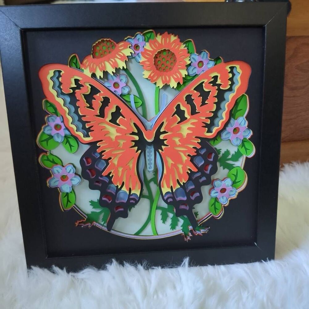 3D Butterfly with Flowers and Papercut.  8x8x" in black frame.